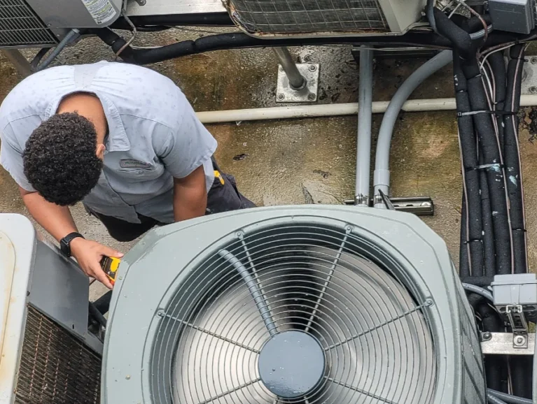 technician-measures-industrial-air-conditioning-un-2026-03-24-04-58-53-utc